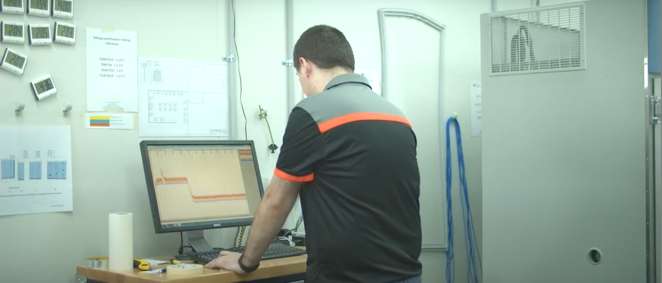 technician analysing data on a computer screen from temperature data logger